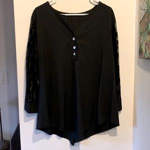 Black blouse with polka dot sleeves